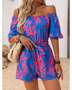 Babe Beachwear off-shoulder beach romper in blue and pink tropical print with ruffle sleeves and waist tie