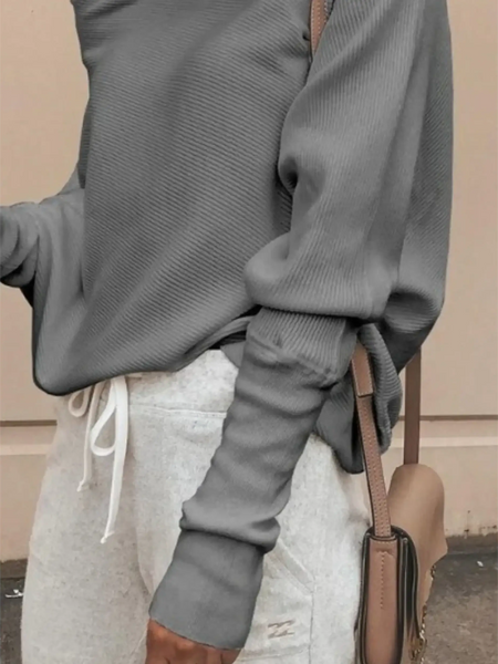 Gray one shoulder ribbed top for curvy women by Babe Beachwaer paired with white drawstring pants and a beige handbag