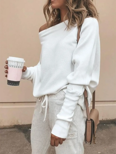 White one shoulder ribbed top for curvy women by Babe Beachwear styled with casual pants and a coffee cup