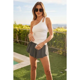 Trendsi white one shoulder summer top sleeveless shirt worn outdoors with black sunglasses