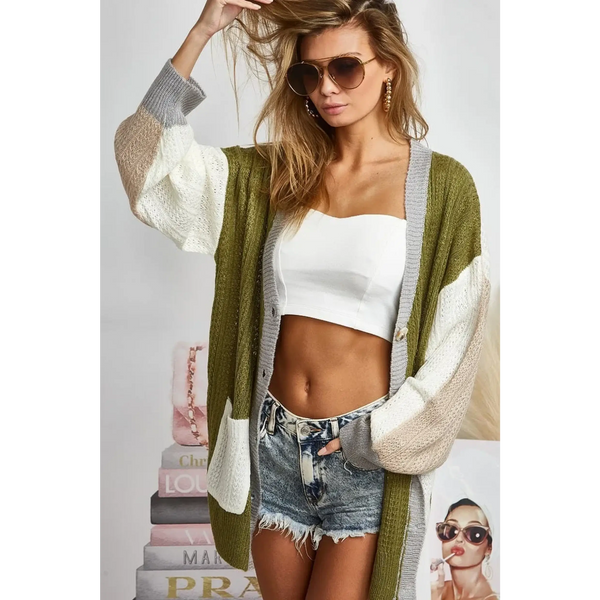 Trendsi oversized cardigan in green white and beige color block worn over white crop top and denim shorts