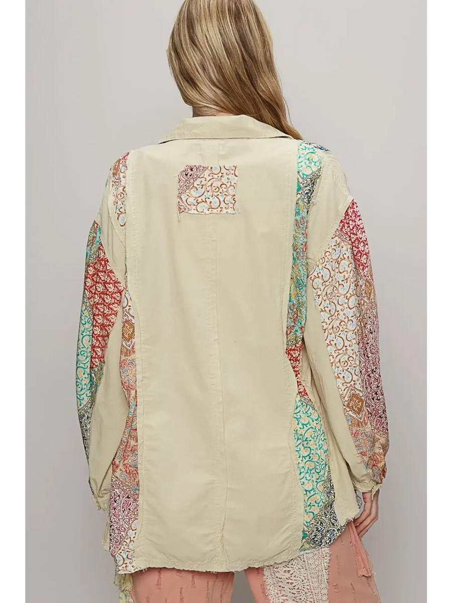 Back view of oversized printed button up shirt by Trendsi with colorful patterned sleeves and beige center