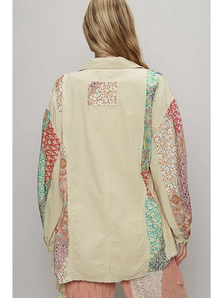 Back view of oversized printed button up shirt by Trendsi with colorful patterned sleeves and beige center