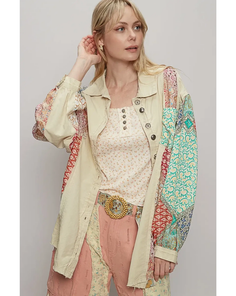 Trendsi oversized printed button up shirt with patchwork sleeves worn by woman with blonde hair