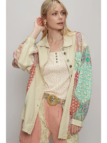 Trendsi oversized printed button up shirt with patchwork sleeves worn by woman with blonde hair