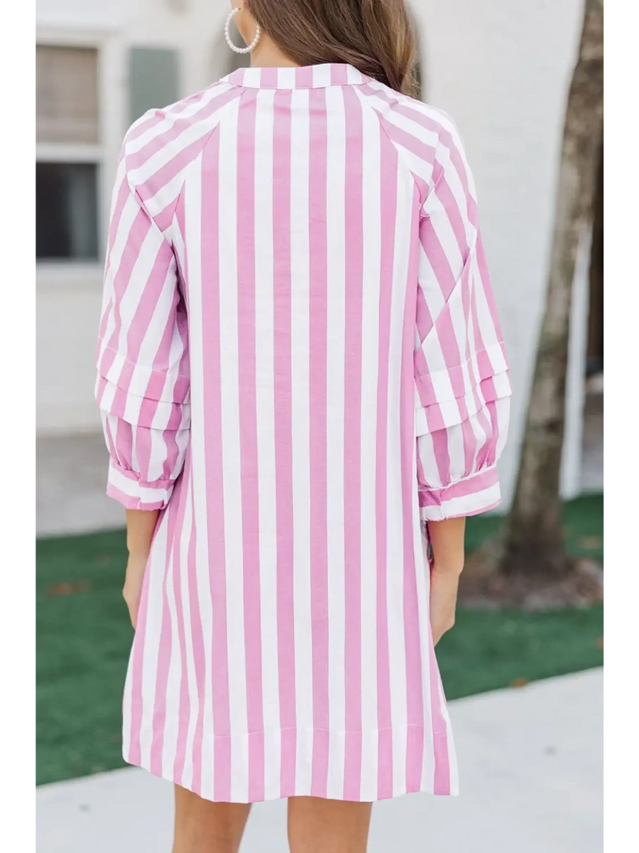 Back view of pink and white long sleeve vacation dress with vertical stripes on mini dress by Trendsi