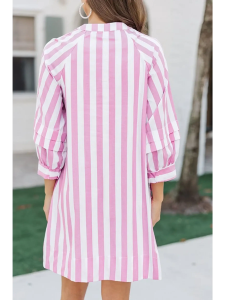 Back view of pink and white long sleeve vacation dress with vertical stripes on mini dress by Trendsi