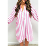Woman showing long sleeve front pink and white long sleeve vacation dress with vertical stripes and button detail