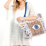 Pom Pom Evil Eye bag by Babe Beachwear with colorful geometric patterns and blue strap