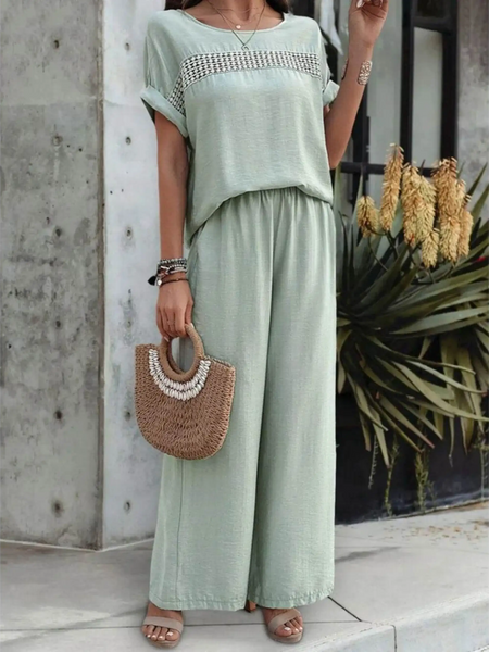 Light green satin pants set featuring wide-leg pants and a loose top with decorative detailing