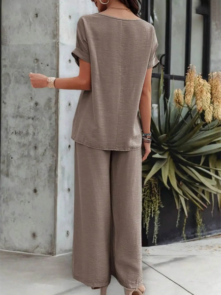 Back view of a woman wearing taupe satin Pants Set with short sleeves and wide-leg pants from Babe Beachwear