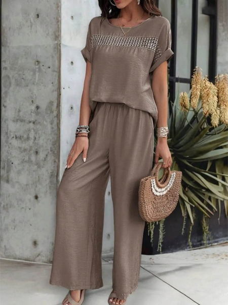 Babe Beachwear satin Pants Set in taupe with short sleeves and wide-leg pants styled with a woven handbag