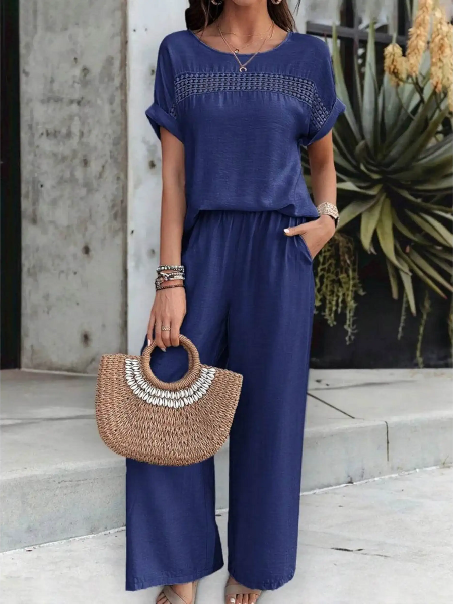 Babe Beachwear navy satin Pants Set with short sleeves and wide-leg pants styled with woven handbag