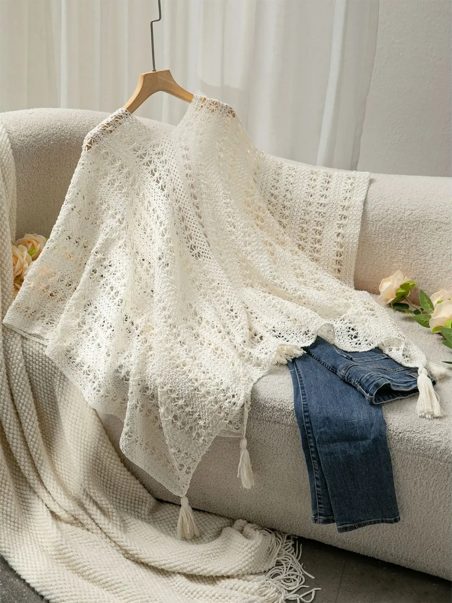Trendsi long sleeve shawl lightweight knit in white draped over sofa with denim jeans