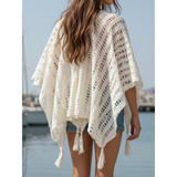 Trendsi white shawl lightweight knit long sleeve open front with tassels on a woman by the water