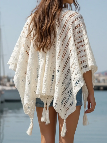 Trendsi white shawl lightweight knit long sleeve open front with tassels on a woman by the water