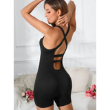 Black summer beach active romper for women by Trendsi with crisscross back straps and fitted design