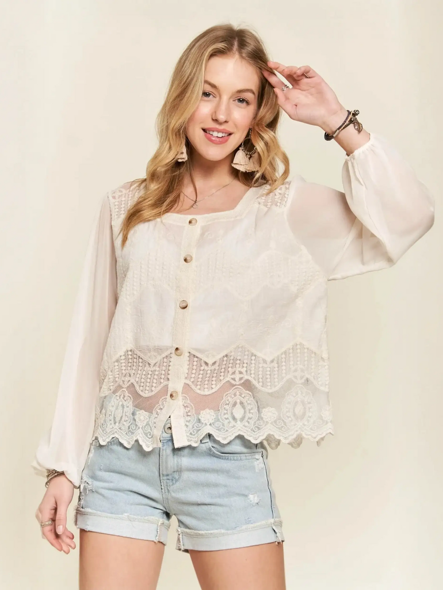Trendsi summer blouse with lace featuring sheer long sleeves and button front design worn with denim shorts