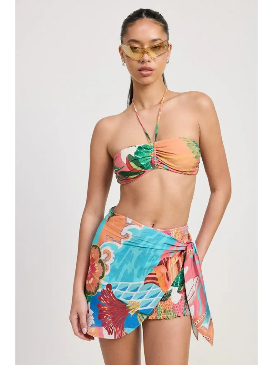 Emory Park model wearing a colorful Tangerine Bikini Bralette with tropical print and matching sarong