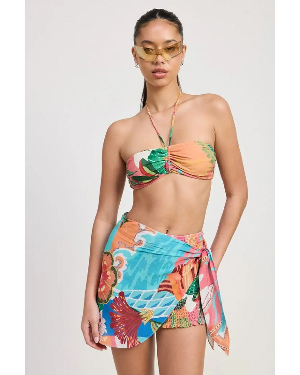 Emory Park model wearing a colorful Tangerine Bikini Bralette with tropical print and matching sarong