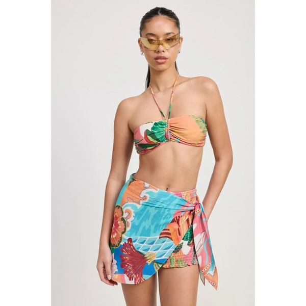 Emory Park model wearing a colorful Tangerine Bikini Bralette with tropical print and matching sarong