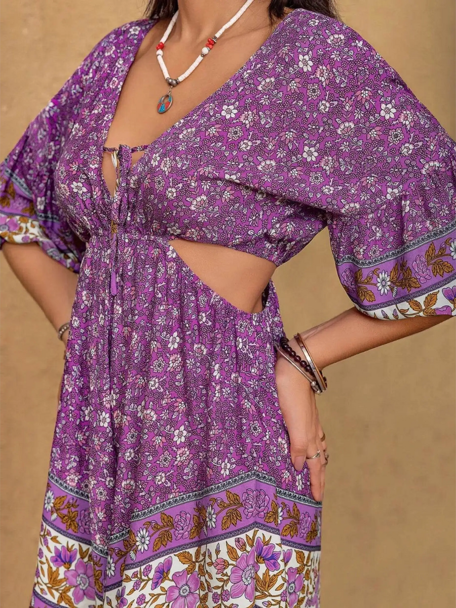 Purple floral tied front cutout romper from Babe Beachwear with three-quarter sleeves and boho pattern