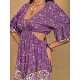 Purple floral tied front cutout romper from Babe Beachwear with three-quarter sleeves and boho pattern