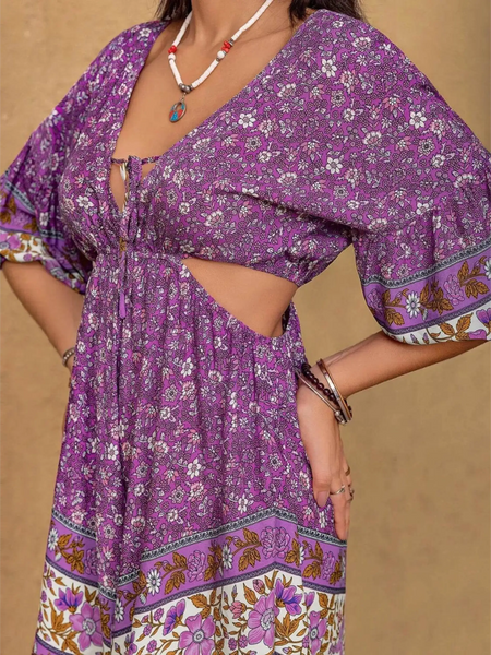 Purple floral tied front cutout romper from Babe Beachwear with three-quarter sleeves and boho pattern