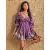 Babe Beachwear purple floral tied front cutout romper with 3 quarter sleeves and decorative border