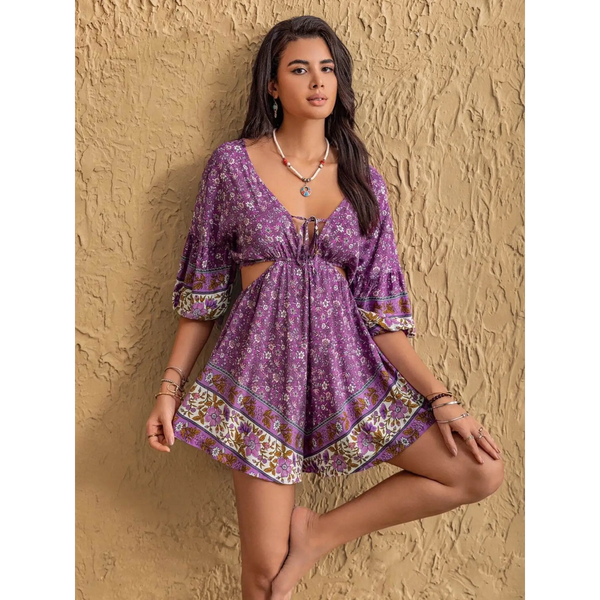 Babe Beachwear purple floral tied front cutout romper with 3 quarter sleeves and decorative border