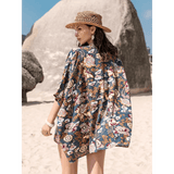 Trendsi floral short set worn by woman with woven hat on beach trendy vacation outfit women