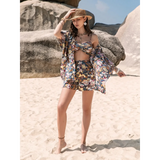 Trendsi short set with floral print worn as trendy vacation outfit women on the beach