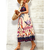 woman showing side view of  midi dress with colorful tropical print and sleeveless design perfect as a tropical summer dress for women