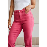 Trendsi pink tummy control high waist jeans worn by woman with white top
