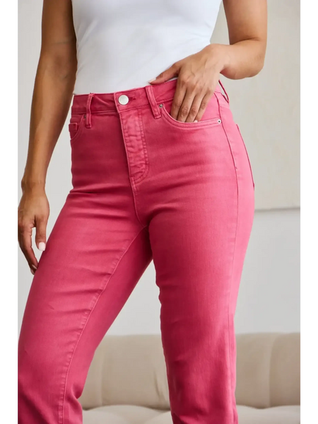 Trendsi pink tummy control high waist jeans worn by woman with white top