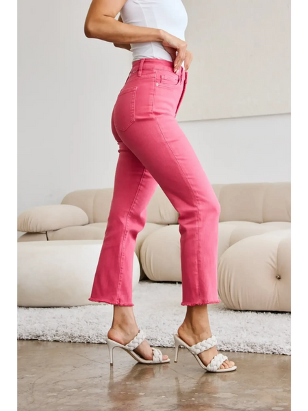 Trendsi pink tummy control high waist jeans worn with white top and beige heels in a modern living room