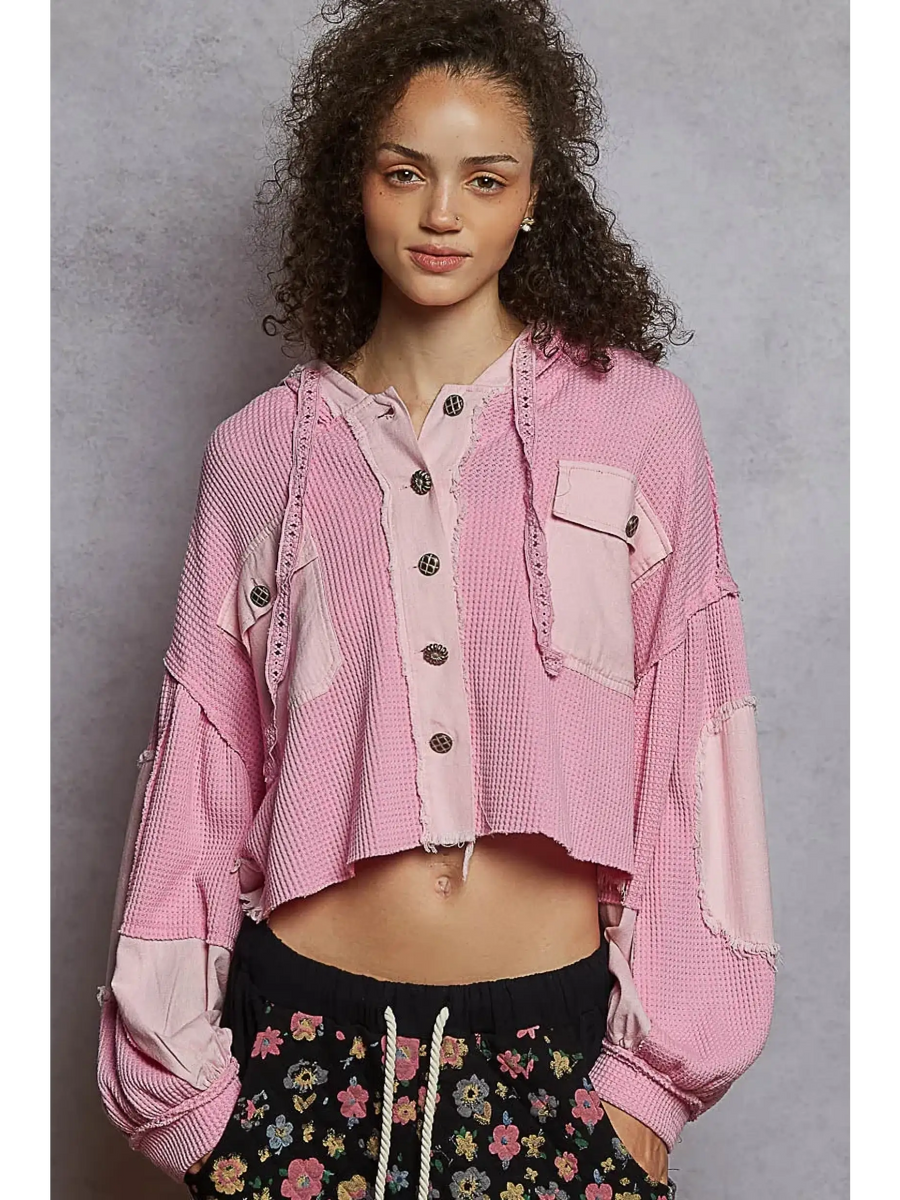 Pink long sleeve women's cropped hooded jacket with button-up front and patch details