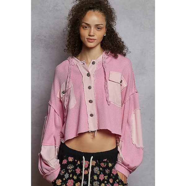 Pink long sleeve women's cropped hooded jacket with button-up front and patch details