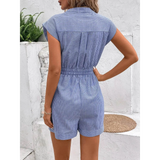Back view of Babe Beachwear blue striped waist tie romper with short sleeves and cuffed shorts