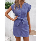 woman wearing a and handbag Babe Beachwear blue striped waist tie romper with short sleeves and front pockets