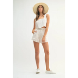White Beach Summer Crop top Short set worn by woman with sun hat and white sneakers