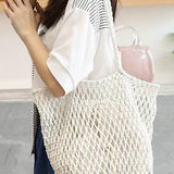 Miss Sparkling white braided net beach tote bag worn by woman holding coffee cup