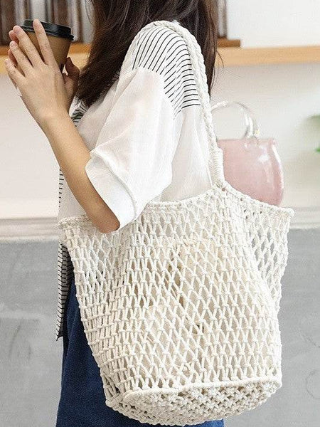 Miss Sparkling white braided net beach tote bag worn by woman holding coffee cup