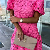 Trendsi pink lace midi dress with puff sleeves styled with beige YSL clutch and watch