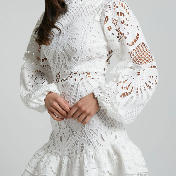 Babe Beachwear white lace mini cocktail dress with long puff sleeves and ruffled hem