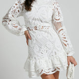 Babe Beachwear white lace mini cocktail dress with long sleeves and ruffled hem