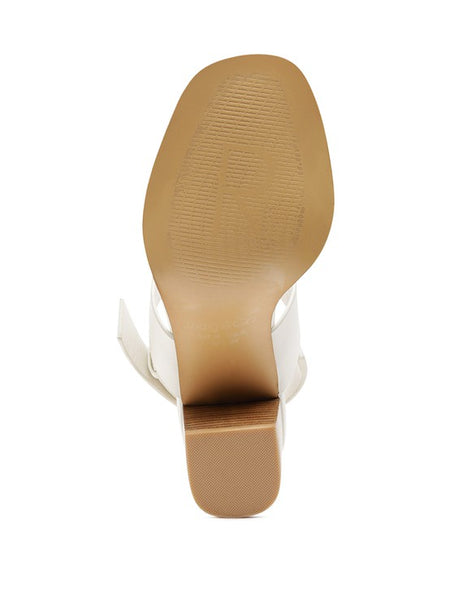 Bottom view of tan slingback block heel sandals from Rag Company showing sole and heel design