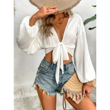 Trendsi white tie front long sleeve cropped top with balloon sleeves styled with denim shorts