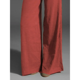 Babe Beachwear wide leg pocketed pants mid rise in rust color with flowy fabric and relaxed fit