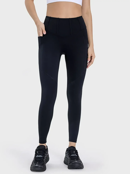  black women's active leggings with pockets in slim fit worn with black sneakers